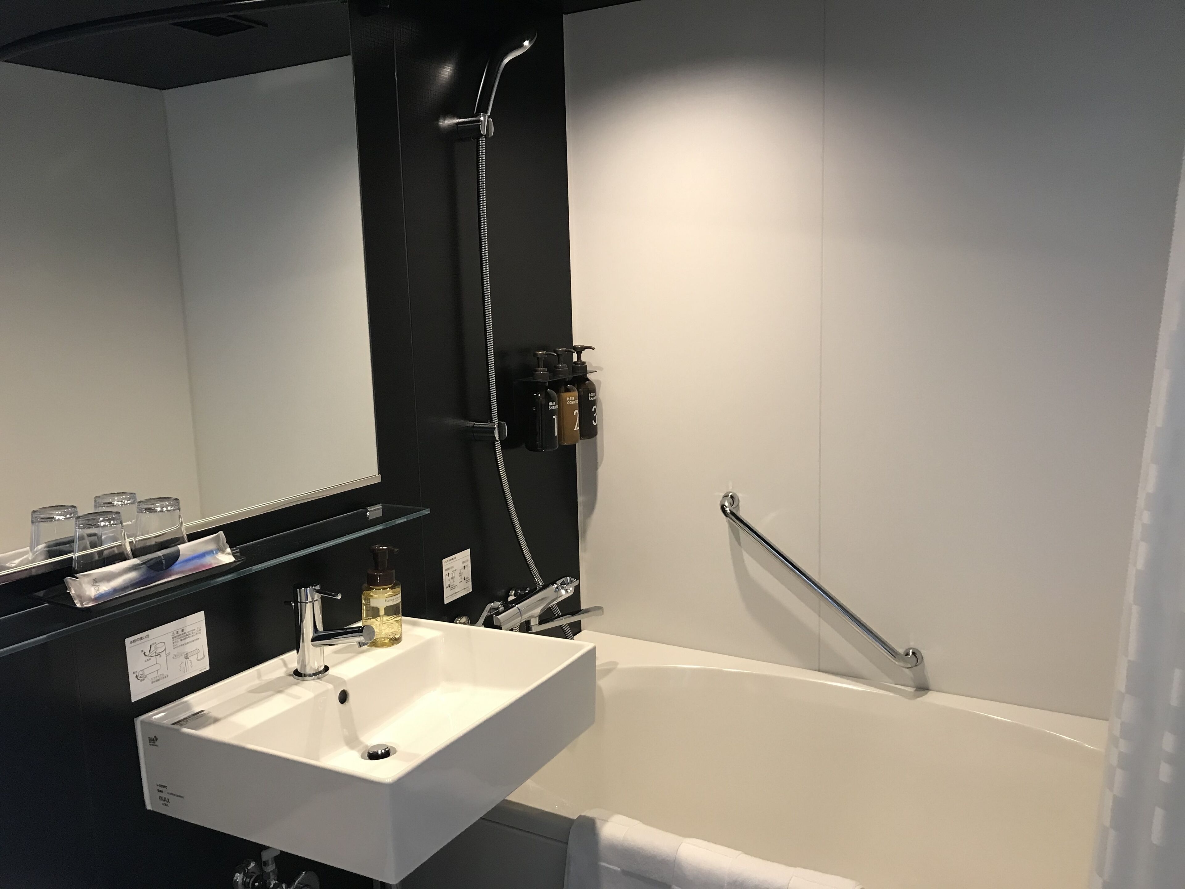 separate bathtub and shower, slippers, towels