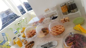 A breakfast buffet with various food items and utensils on a table. - Santa Marina Bed & Breakfast (Massafra)