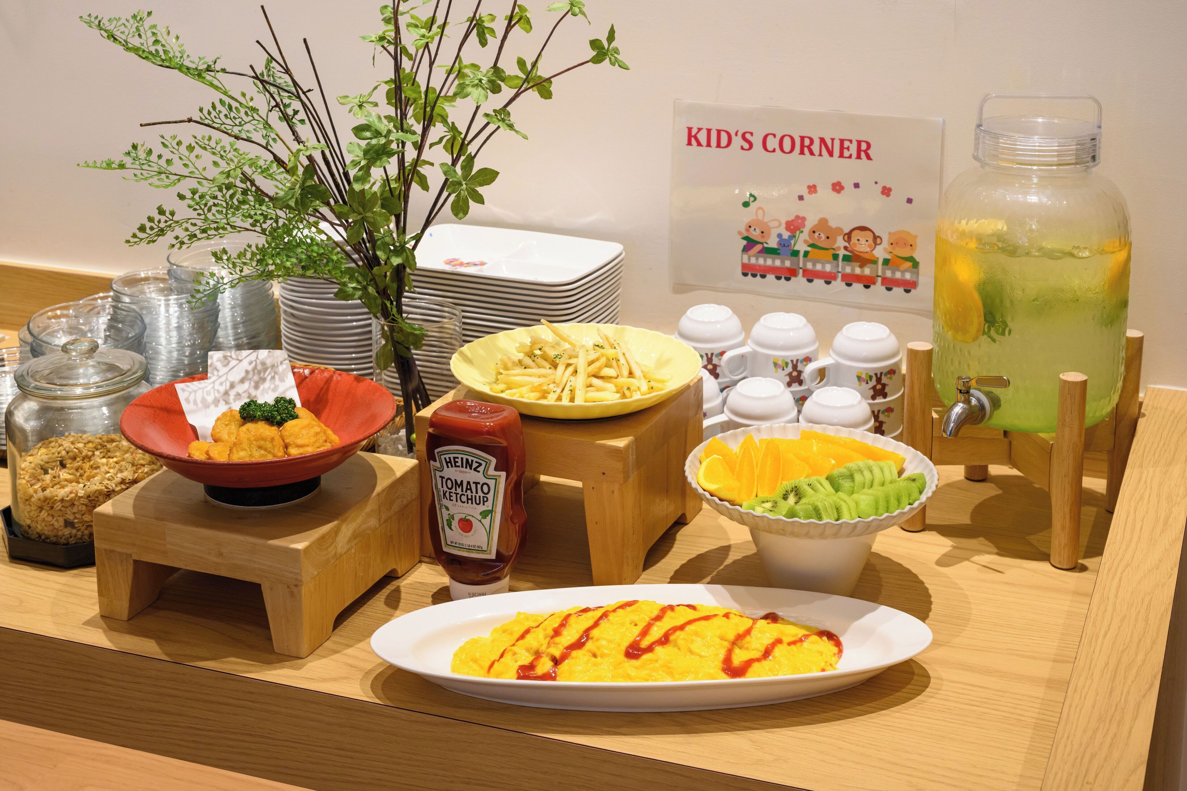A breakfast buffet with various food items and condiments.