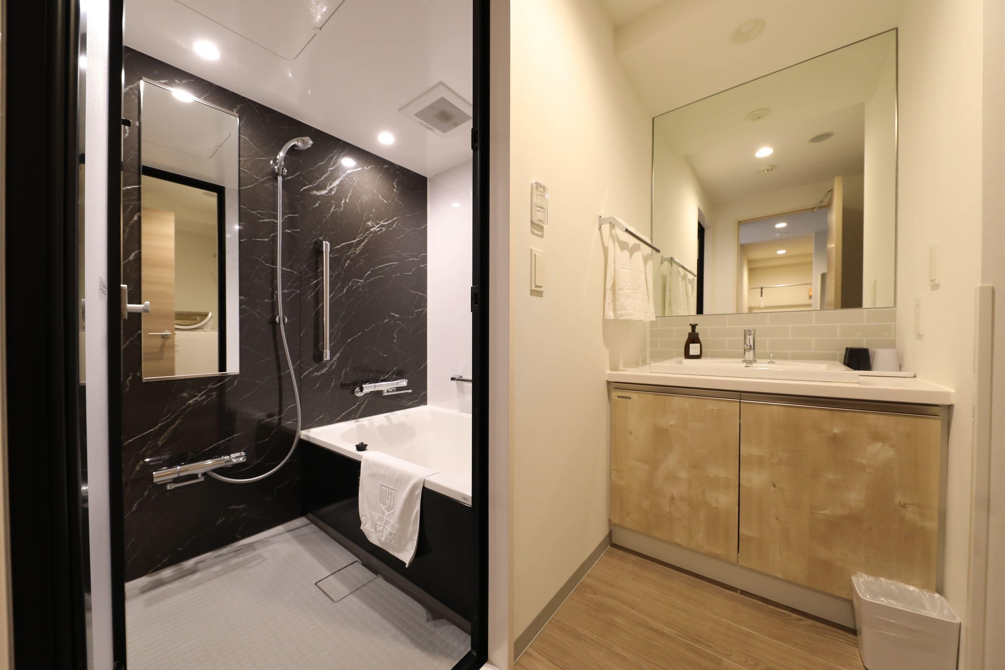 combined shower/bathtub, free toiletries, hair dryer, slippers