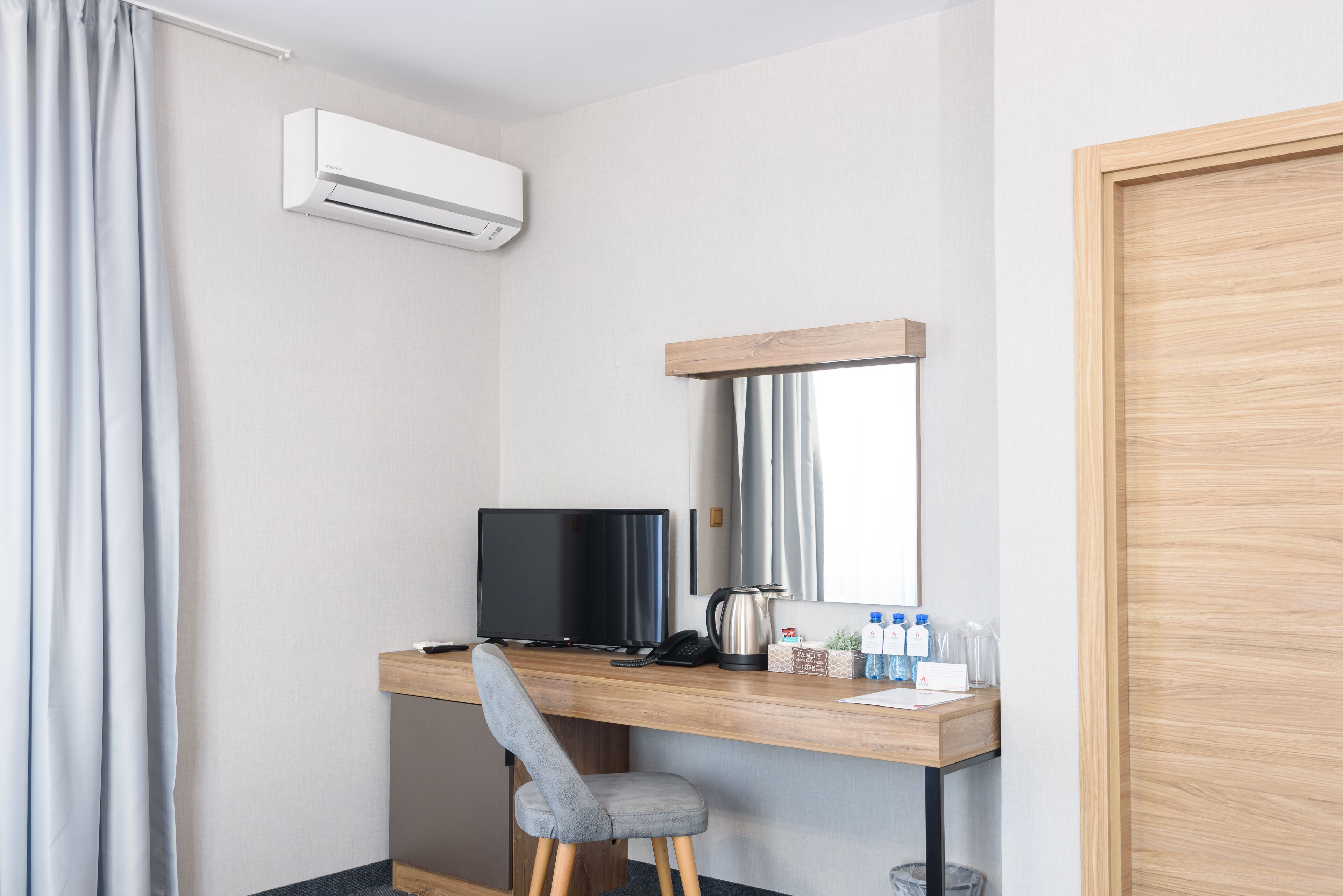 deluxe triple room | 1 bedroom, in-room safe, desk, iron/ironing board