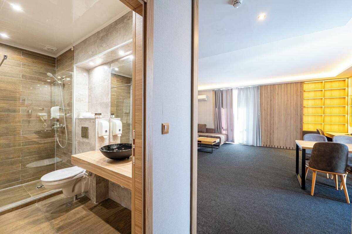 deluxe apartment | living area | flat-screen tv