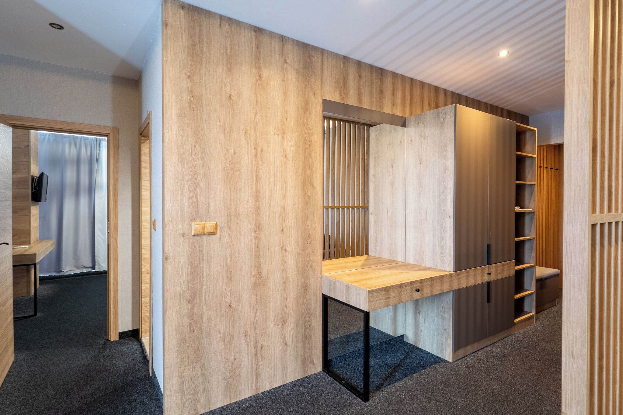 deluxe apartment | living area | flat-screen tv