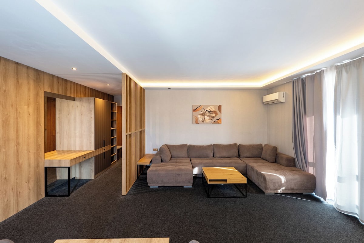 deluxe apartment | living area | flat-screen tv