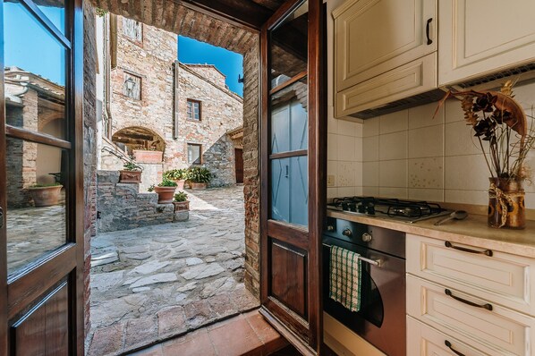 Fridge, oven, coffee/tea maker, cookware/dishes/utensils