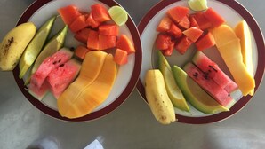 Two plates of assorted fruits on a table. - Villa Forest View (Kandy)