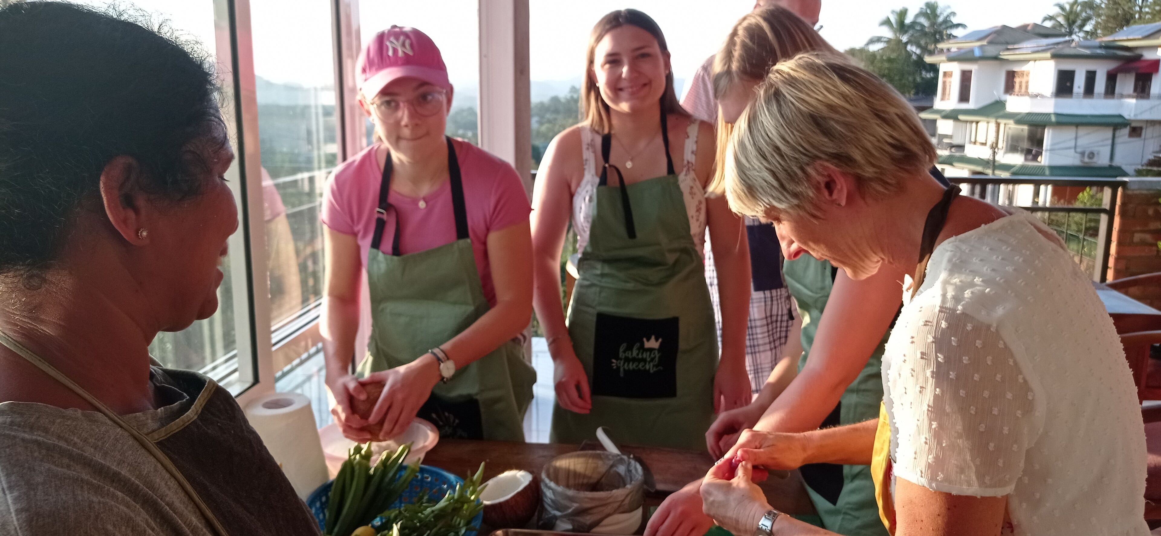 A group of people engaged in a cooking activity, with a window in the background.