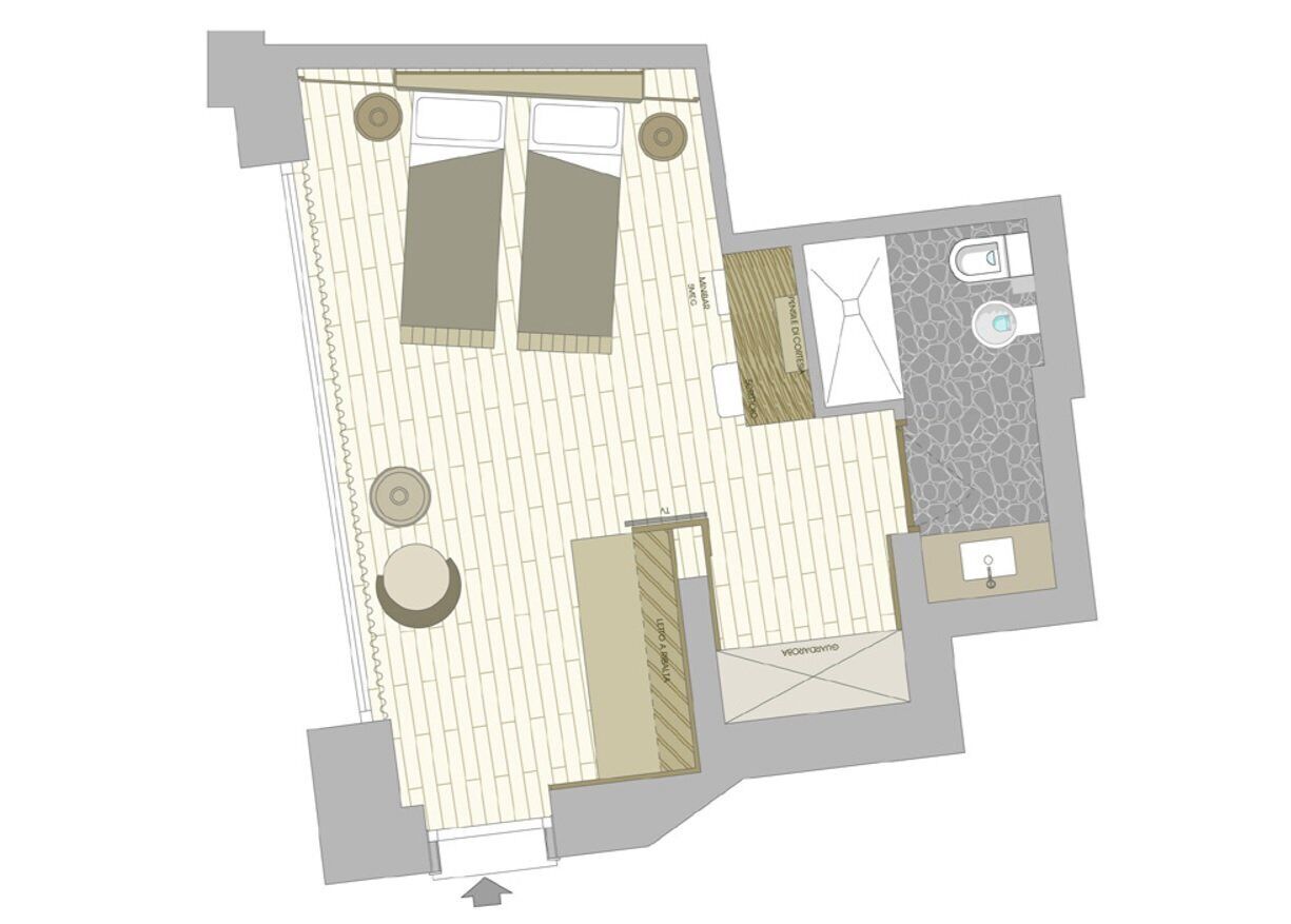 A floor plan with a bathroom, a kitchen, and a living area.