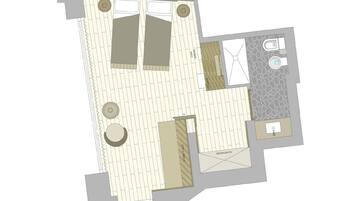 A floor plan with a bathroom, a kitchen, and a living area.