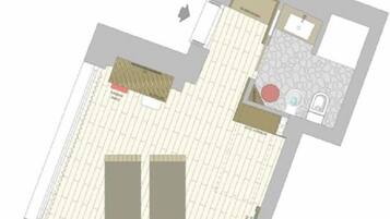 Un plan d’étage d’hôtel comprenant un couloir central, deux chambres, une salle de bain et un petit coin salon.