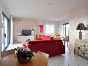 Luxury Apartment | Living area | 32-inch TV with digital channels