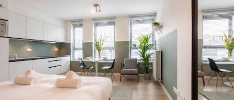 1 bedroom, desk, iron/ironing board, travel crib