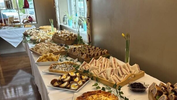 A buffet table with various food items including sandwiches, quiches, and French fries. - The Haven Inn (Barrow upon Humber)