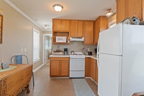 Microwave, coffee/tea maker, cookware/dishes/utensils
