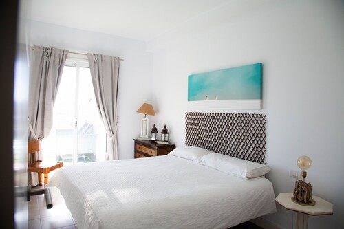 At sea level, and overlooking the beach.  Apartment with terrace and 8 hrs of sun