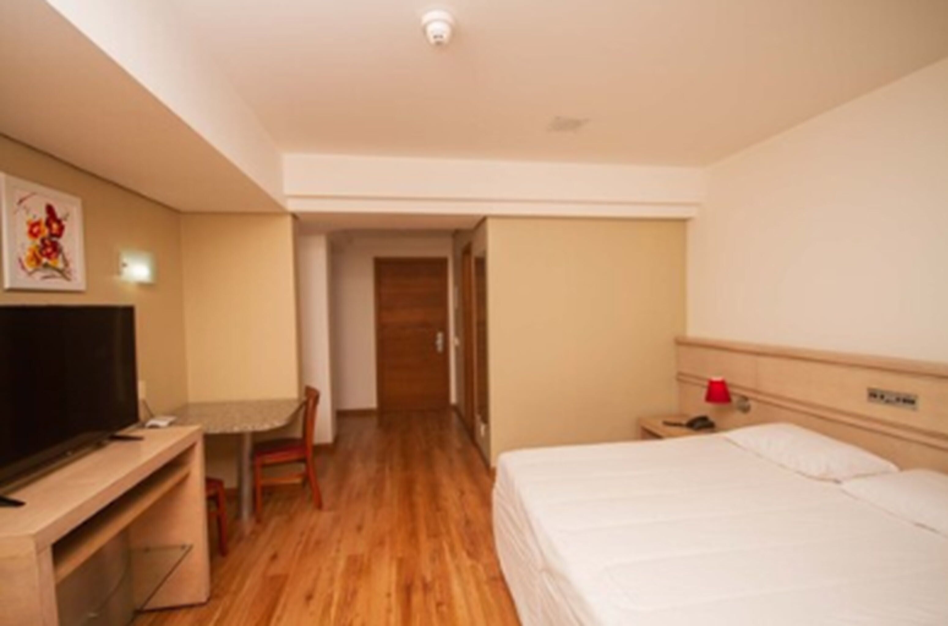 Minibar, desk, laptop workspace, blackout curtains