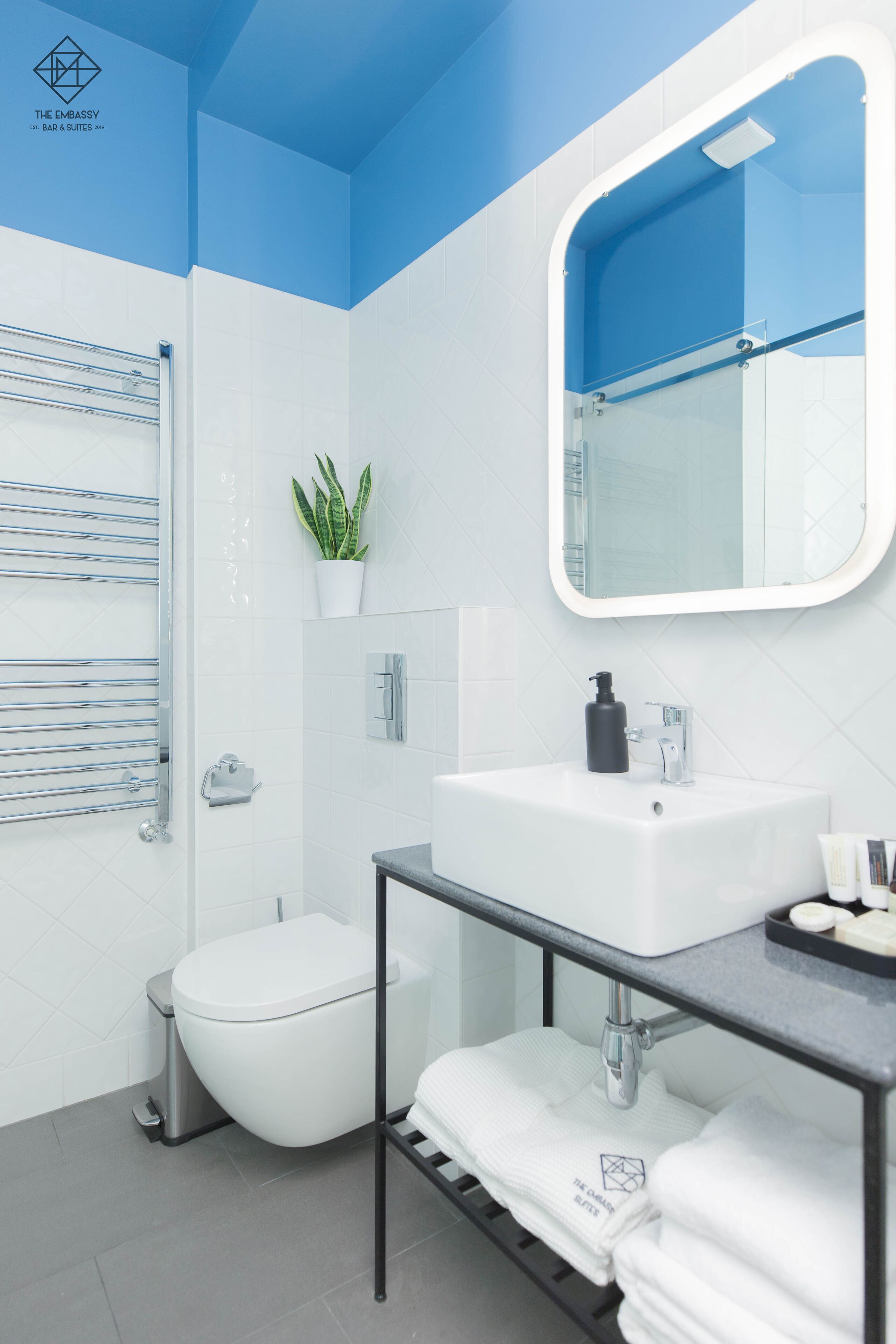 shower, bathrobes, slippers, towels