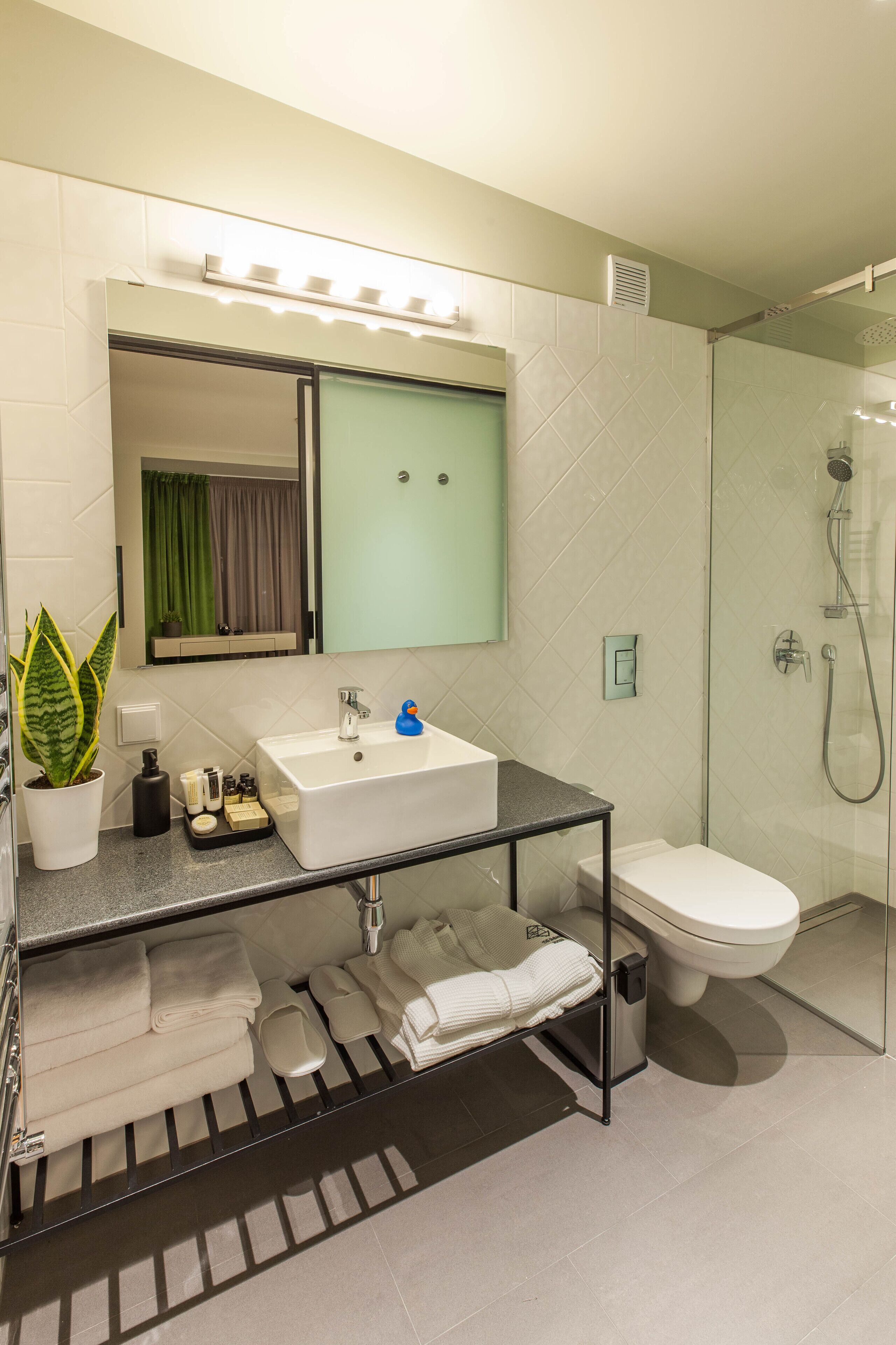 shower, bathrobes, slippers, towels