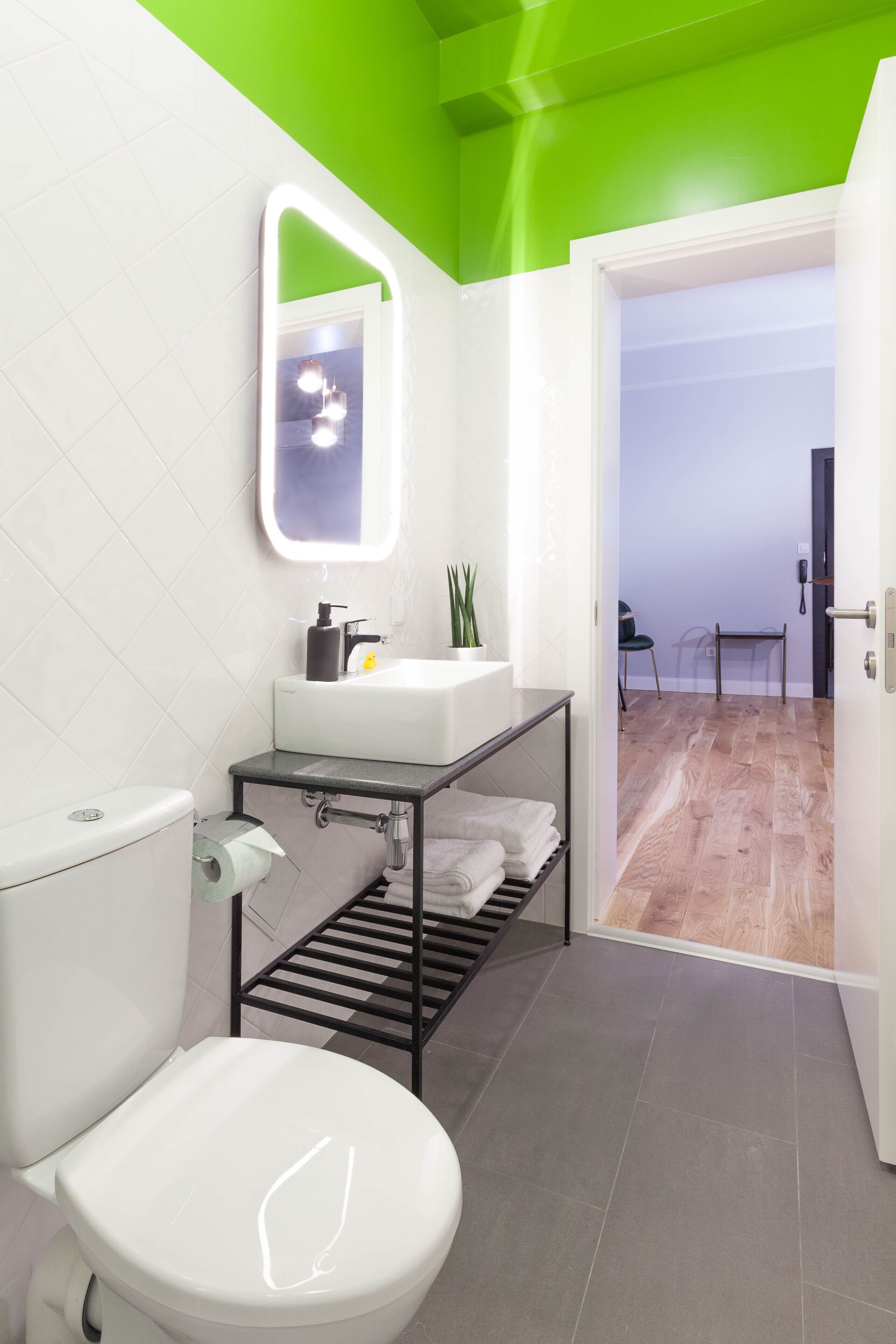 deluxe suite | bathroom | shower, bathrobes, slippers, towels