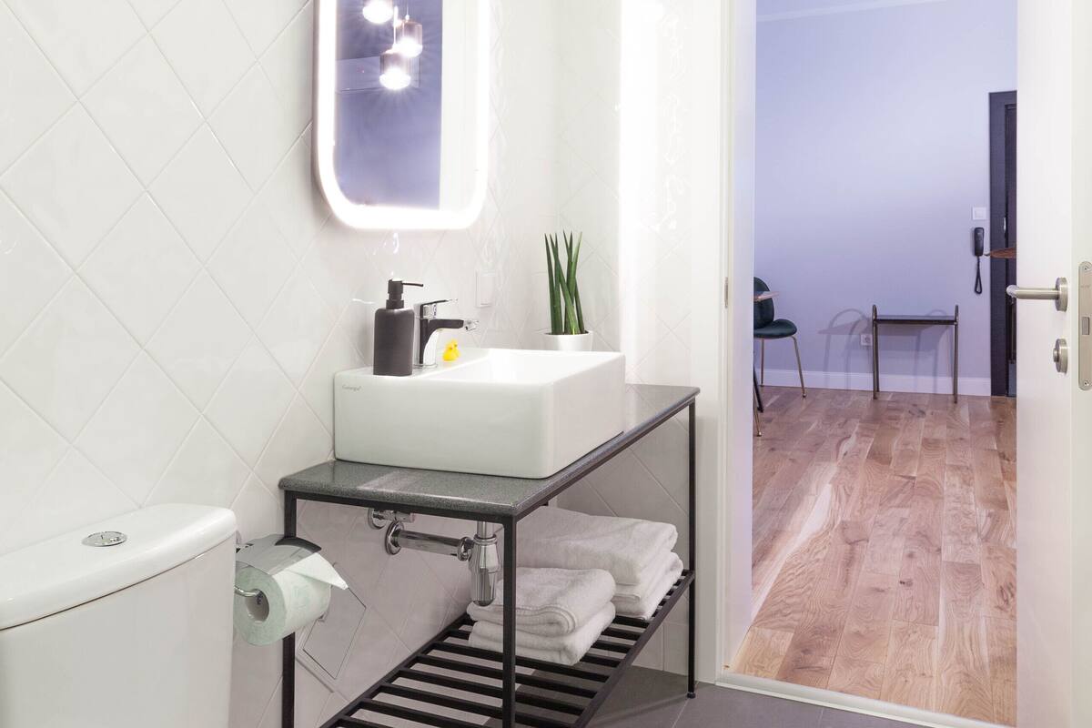 deluxe suite | bathroom | shower, bathrobes, slippers, towels