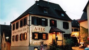 A two-story building with the name 'ADLER' prominently displayed on the facade. - Adler Gaststube Hotel Biergarten (Bad Rappenau)