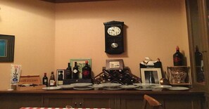Enjoy a meal in the kitchen, where a wall-mounted clock keeps perfect time and a menu stand is always at hand.