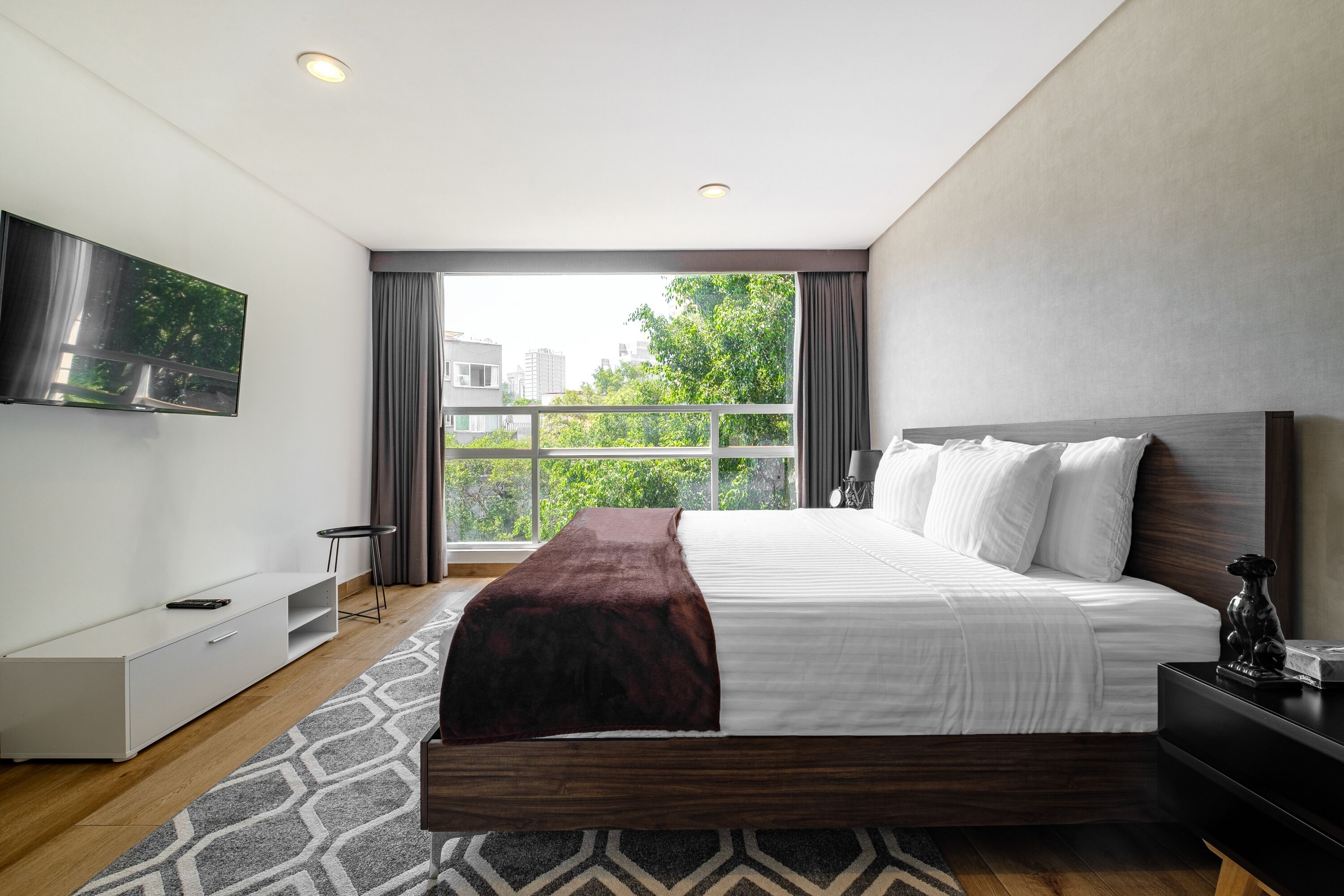 Departamento, 1 habitación | Minibar, caja de seguridad en la habitación, wifi gratis y ropa de cama 