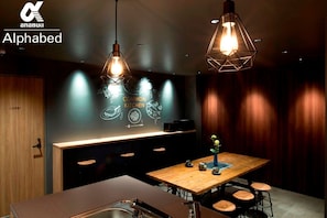 Enjoy casual dining at the central island with a sink and pendant lights.