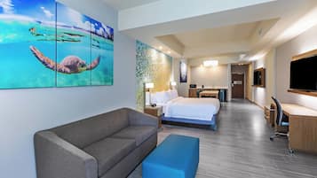 Suite, 1 King Bed with Sofa bed, Balcony | Pool | Outdoor pool, open 9:00 AM to 10:00 PM, pool umbrellas, sun loungers