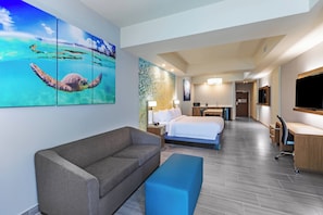 Suite, 1 King Bed with Sofa bed, Balcony | Pool | Outdoor pool, open 9:00 AM to 10:00 PM, pool umbrellas, sun loungers