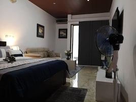 Deluxe Studio | Individually decorated, individually furnished, blackout drapes