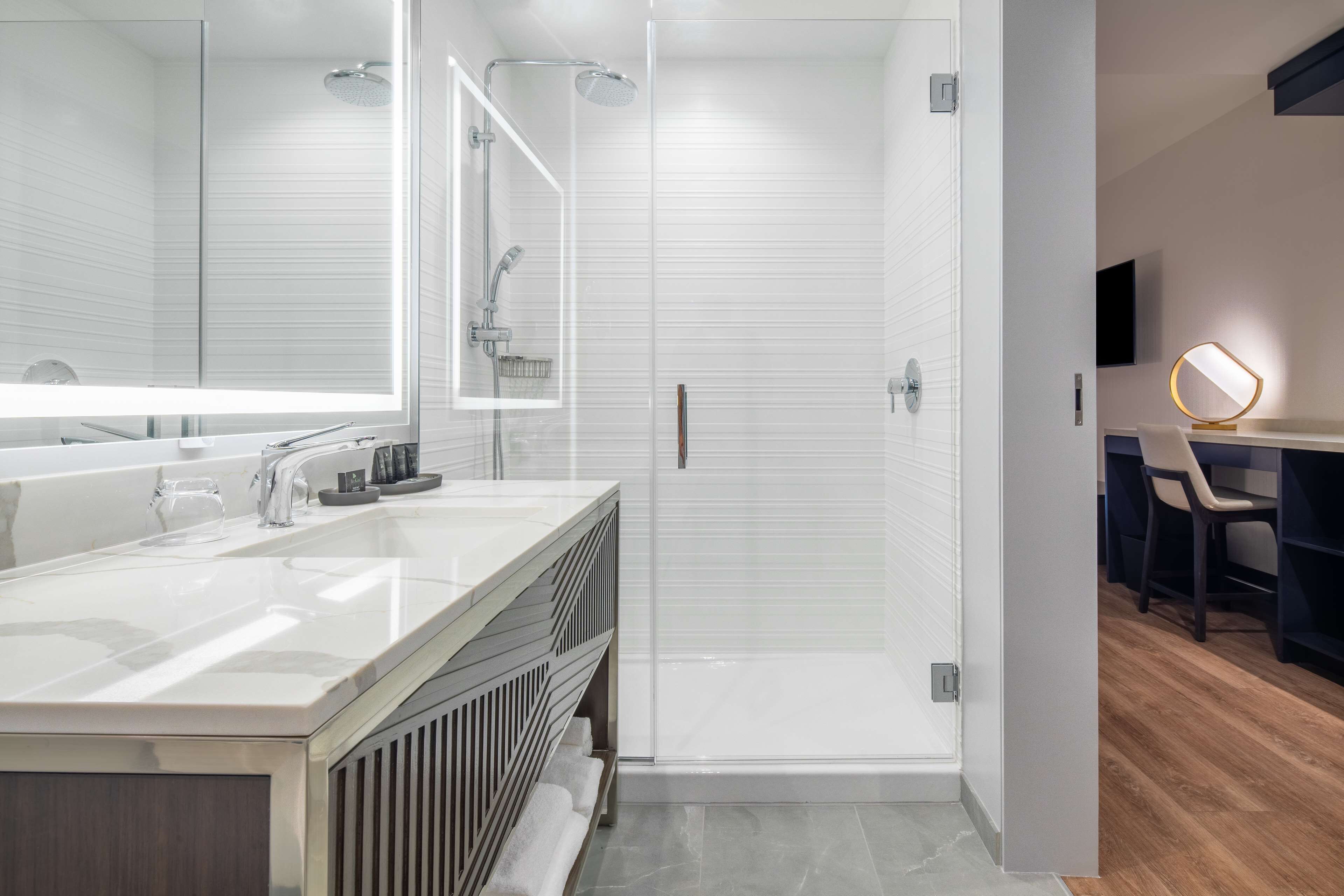 designer toiletries, hair dryer, bathrobes, slippers