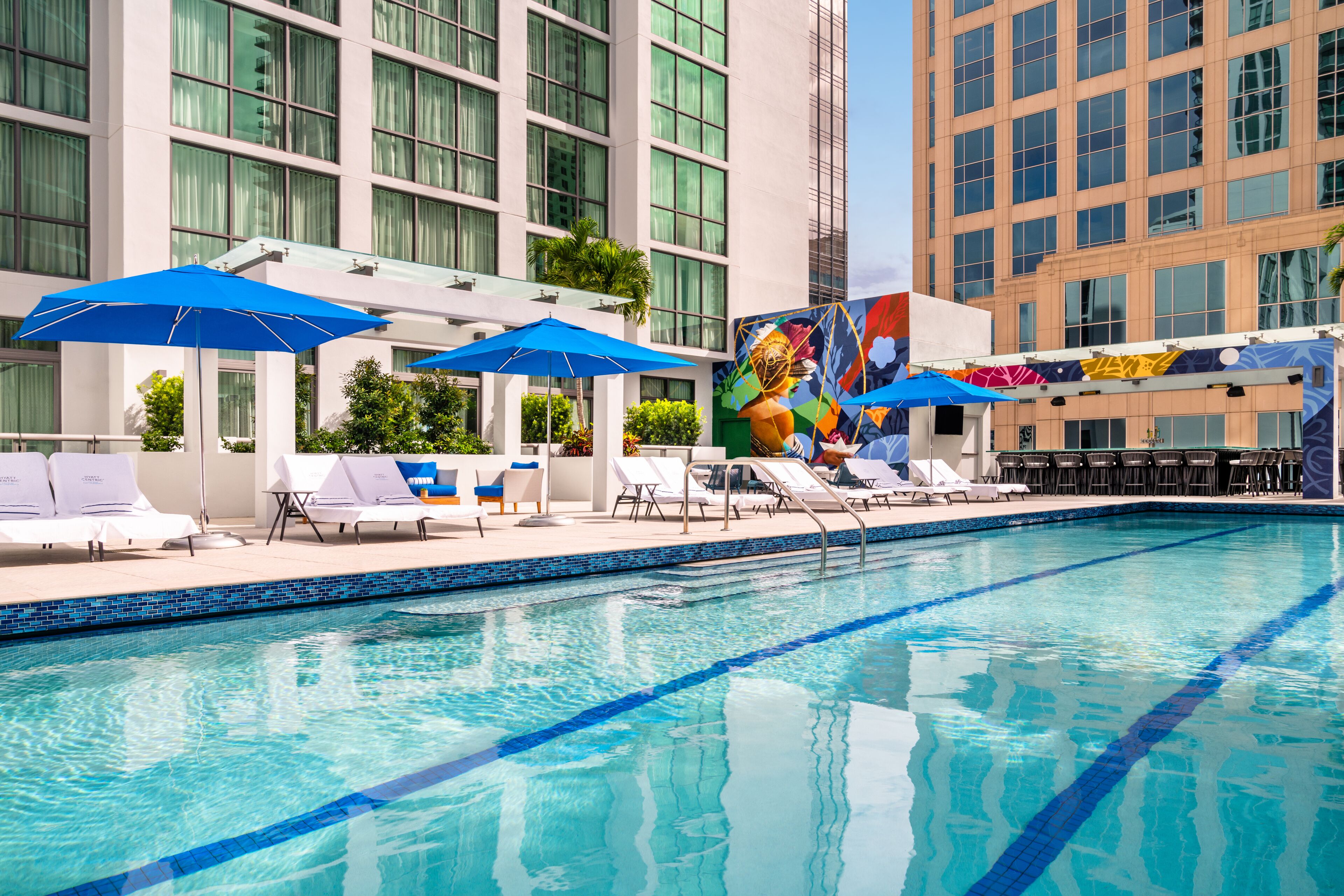 outdoor pool, open 8:00 am to 7:00 pm, pool umbrellas, pool loungers
