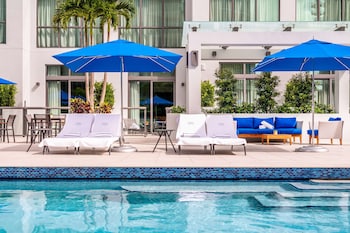 Outdoor pool, open 8:00 AM to 7:00 PM, pool umbrellas, sun loungers at Hyatt Centric Las Olas Fort Lauderdale