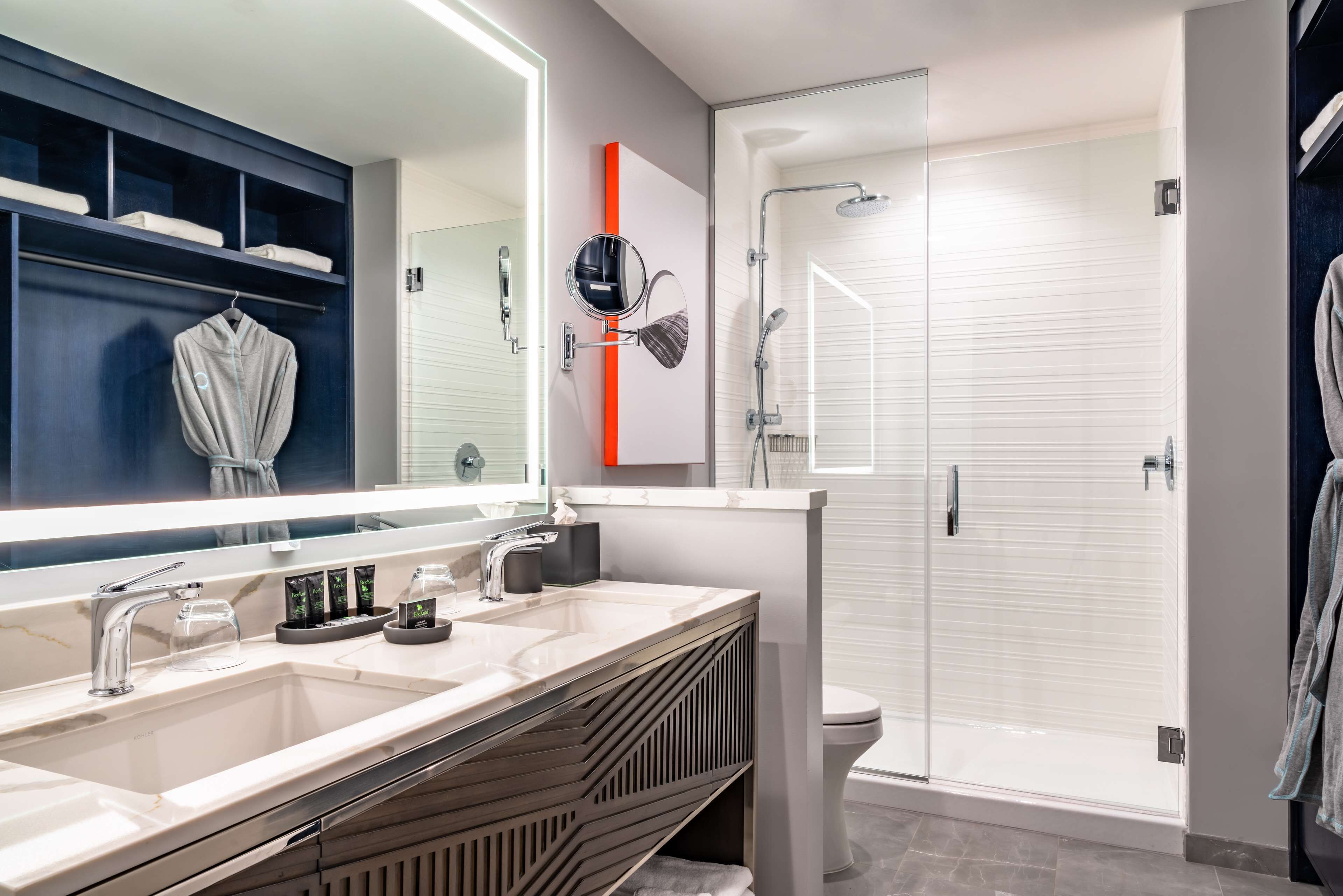 suite (centric) | bathroom | designer toiletries, hair dryer, bathrobes, slippers