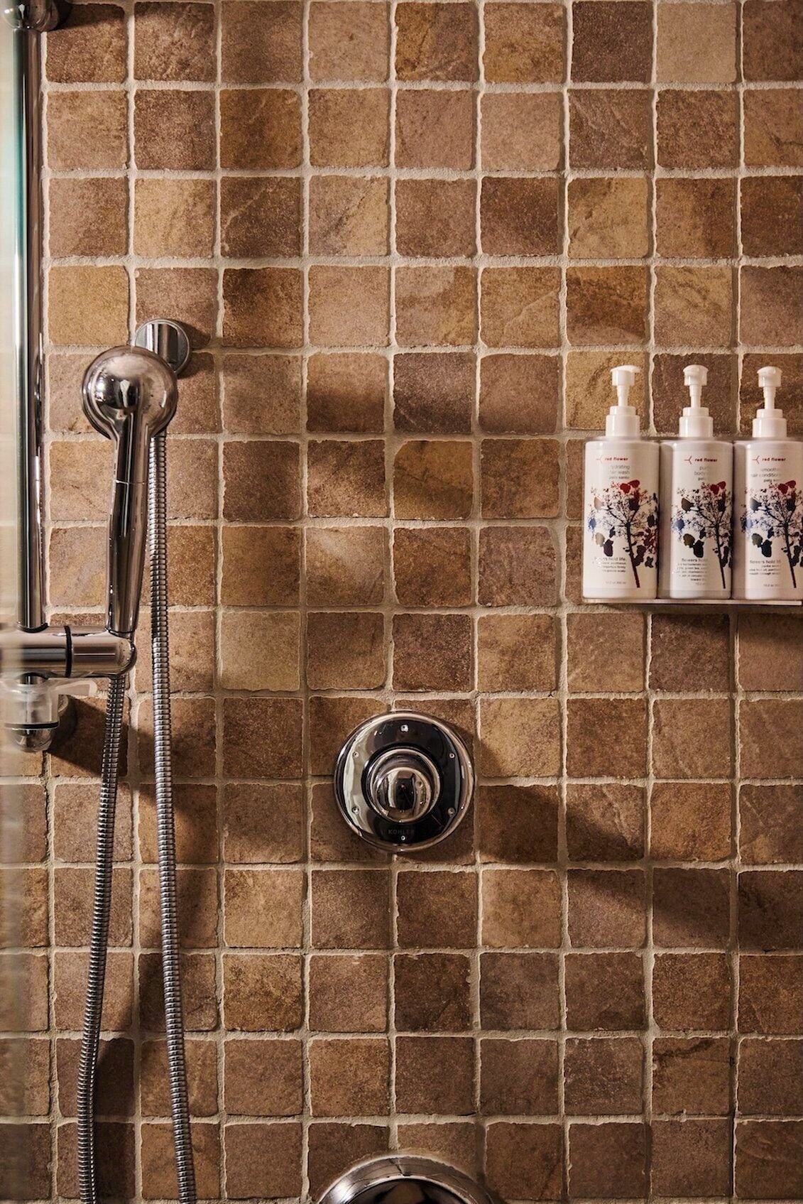 combined shower/bathtub, designer toiletries, hair dryer, bathrobes