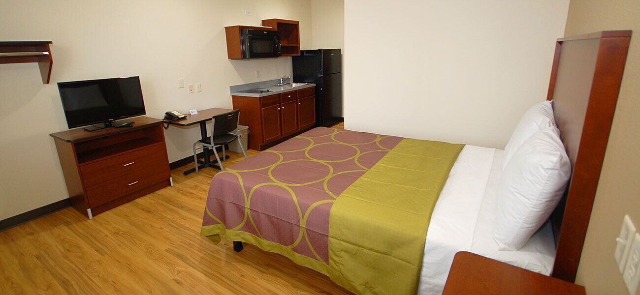 Individually furnished, desk, laptop workspace, blackout drapes