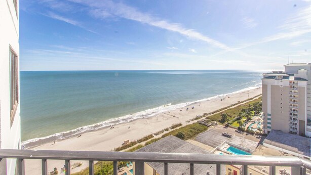 A beachfront hotel with a pool, beach access, and a view of the ocean. - Palace 1513 (Myrtle Beach)