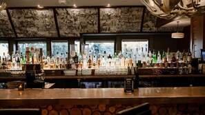 A bar area with a variety of liquor bottles and glasses. - Lake Arrowhead Resort and Spa (Lake Arrowhead)