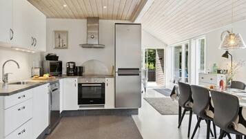 Fridge, stovetop, dishwasher, coffee/tea maker