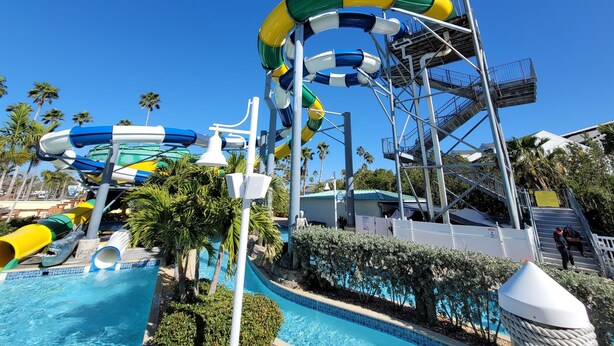 A water park with multiple slides and a pool area.