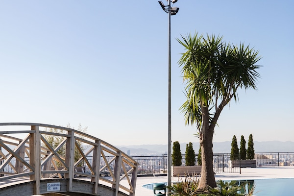 Outdoor pool, open 9:30 AM to 6:00 PM, pool umbrellas, sun loungers
