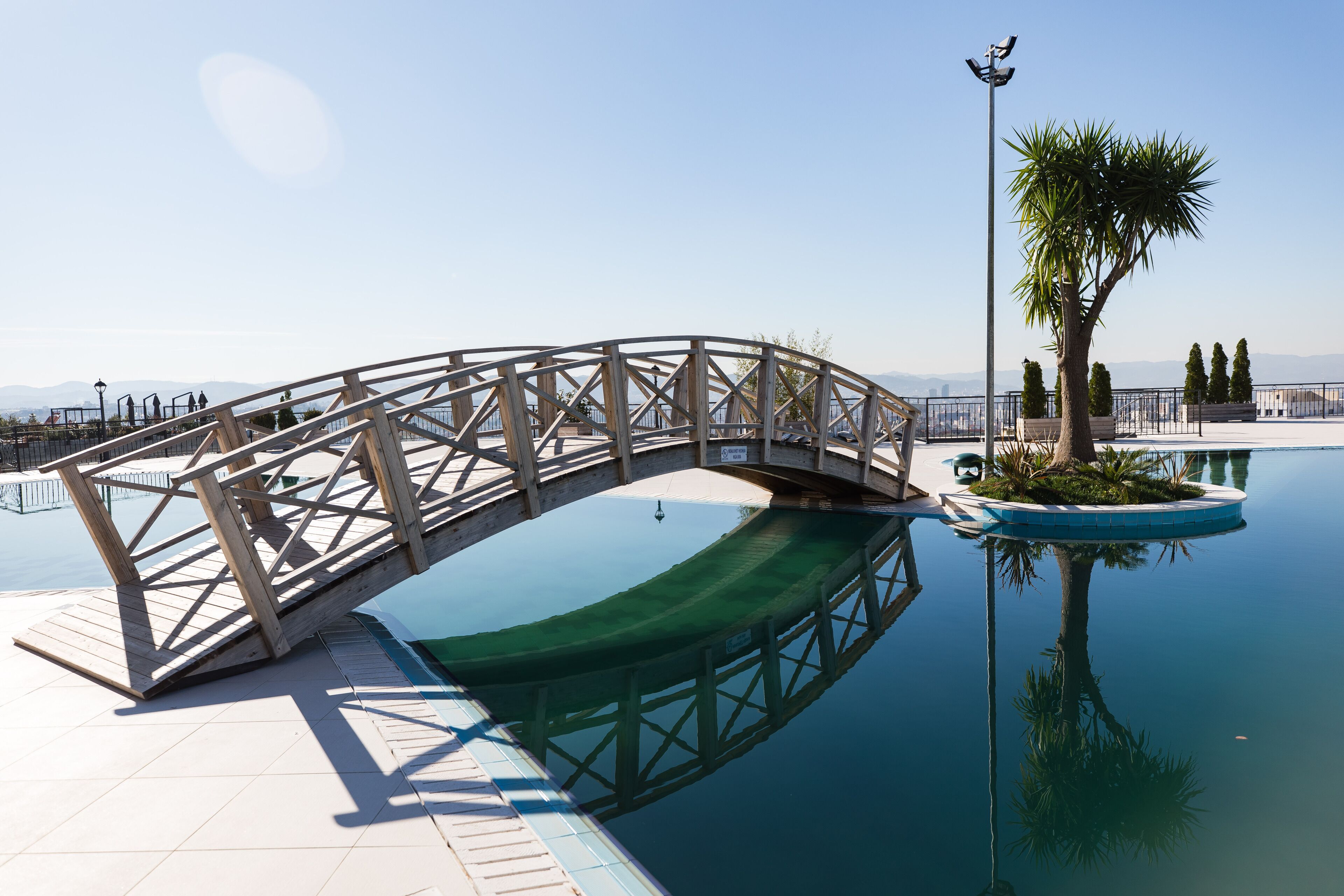 outdoor pool, open 9:30 am to 6:00 pm, pool umbrellas, pool loungers