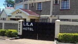 A multi-story building with a sign reading "LILA HOTEL" at the entrance. - Lila Hotel (Kisumu)
