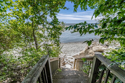 Quaint lakefront cottage w/ private hot tub, firepit, & beautiful sunset views