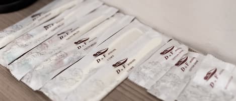 A row of D&F combs on a wooden surface.
