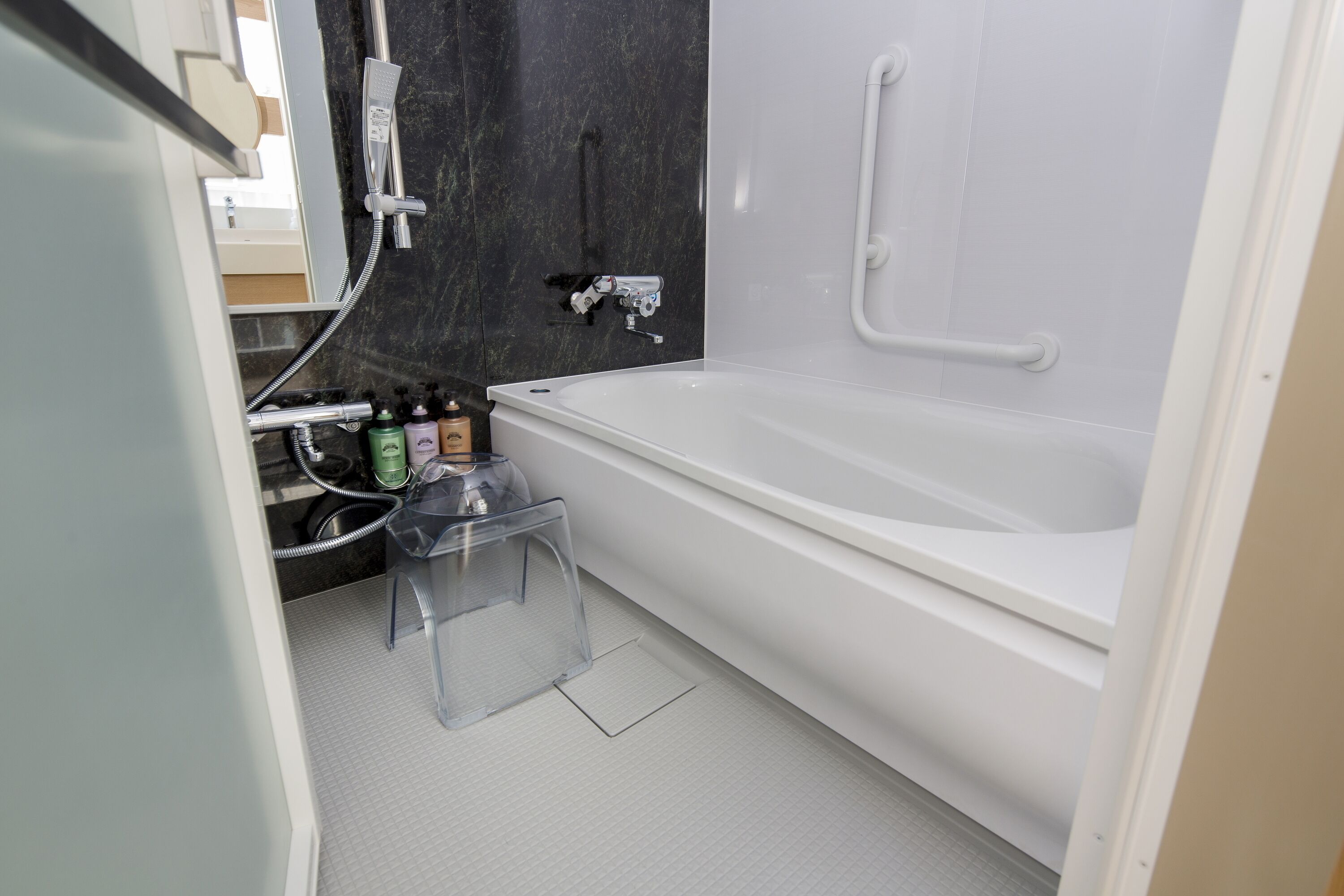 hair dryer, slippers, bidet, towels