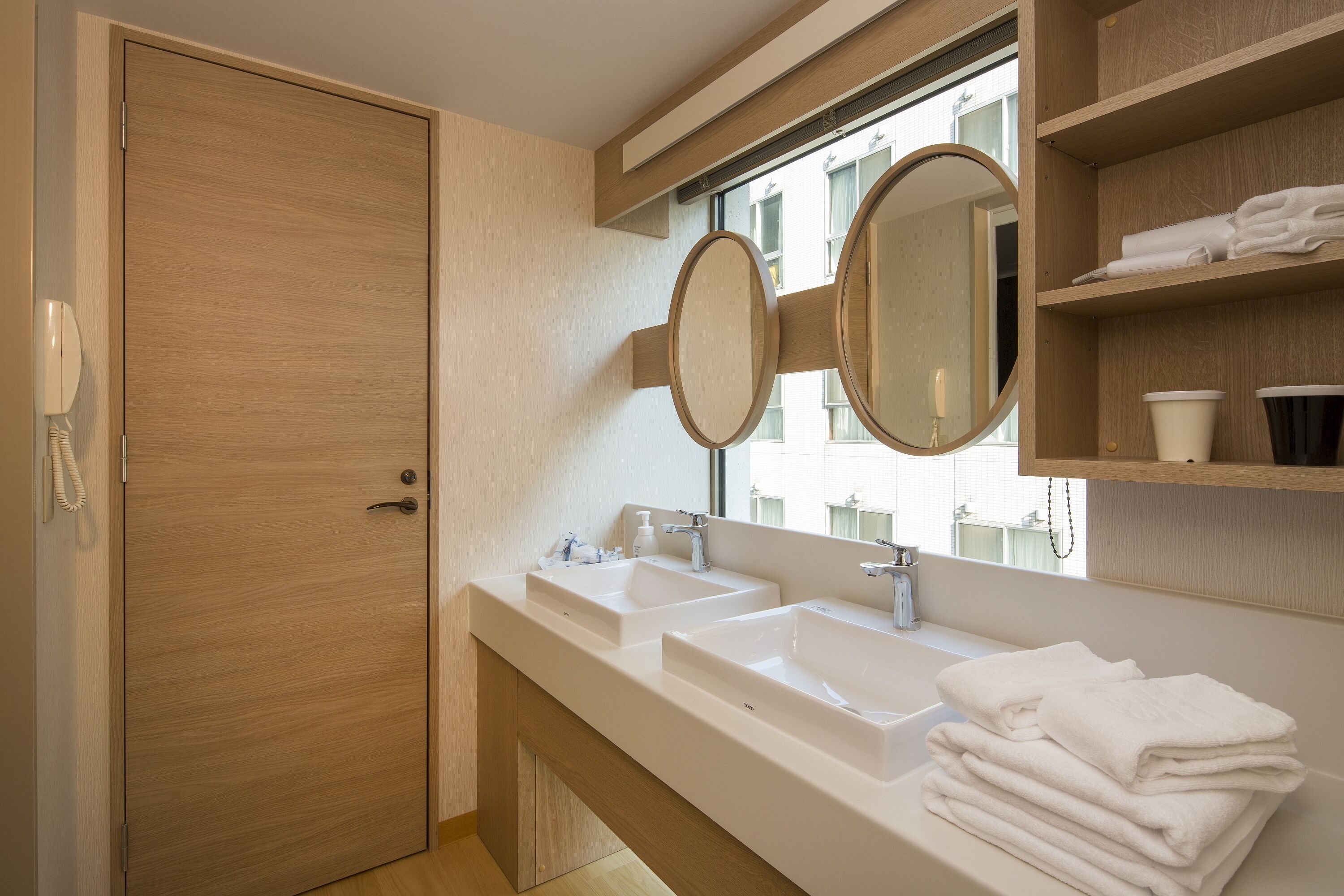 hair dryer, slippers, bidet, towels