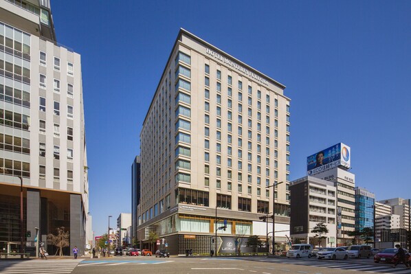 A multi-story hotel with a prominent sign reading "HOTEL MONTEFUGOCA." - Hotel Monterey Fukuoka (Fukuoka)