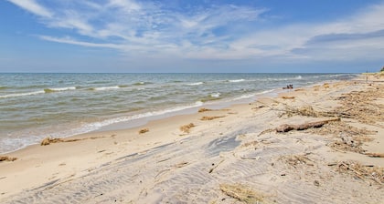 Spacious lakefront home with panoramic views and private beach